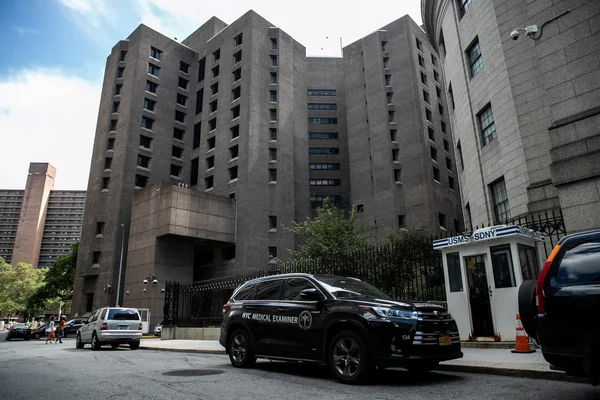 NYC Medical Examiner SUV outside institutional building after Epstein-related death