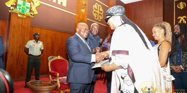 Young Ghanaians in Accra wearing traditional Fugu with modern style.