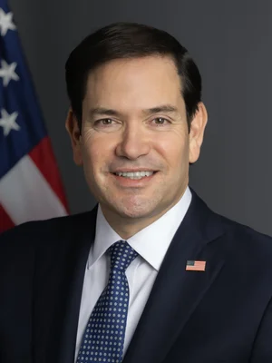 Portrait officiel de Marco Rubio, secrétaire d'État des États-Unis, devant un drapeau américain.