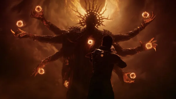 Rahul Kohli face à une entité divine dans une séquence cinématique du jeu Saros.