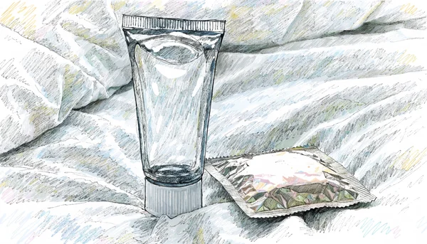 Tube de lubrifiant transparent posé sur un drap blanc froissé, à côté d’un préservatif encore emballé. La composition est simple et épurée, vue en plan rapproché pour mettre en valeur le produit. L’intention éditoriale est de normaliser l’usage du lubrifiant, avec un ton décomplexé et pratique.